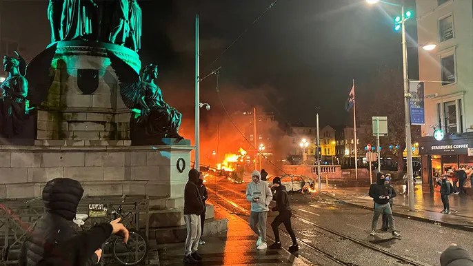 Rioters clash with police, torch car after knife attack in&nbsp;Dublin