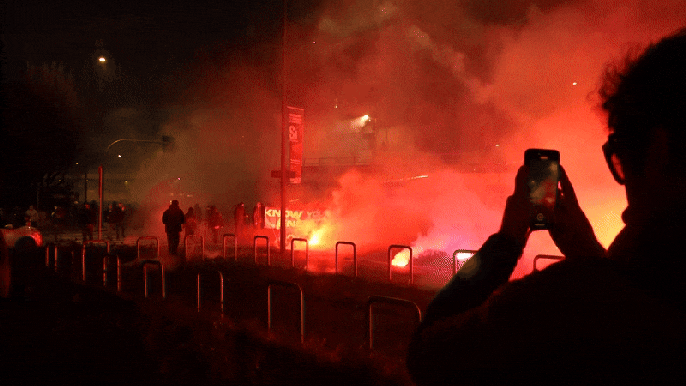 Fireworks fly as hooded protesters clash with police after Olympics open in&nbsp;Milan